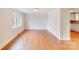 Spacious living room featuring hardwood floors, neutral walls, and ample natural light at 4541 Bradbury Dr, Charlotte, NC 28209