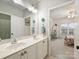 Bright bathroom with double sinks and a view to a bedroom at 516 White Tail Ter, Waxhaw, NC 28173