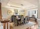 Formal dining room with a tray ceiling, stylish lighting, and ample seating at 516 White Tail Ter, Waxhaw, NC 28173