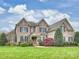 Charming brick home with a well-maintained lawn and mature trees at 516 White Tail Ter, Waxhaw, NC 28173