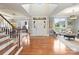 Inviting foyer featuring hardwood floors, a staircase, and a soaring ceiling at 516 White Tail Ter, Waxhaw, NC 28173
