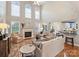 Spacious living room featuring a fireplace, high ceilings, and natural light at 516 White Tail Ter, Waxhaw, NC 28173
