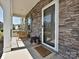 Inviting front porch with stone accents and a cozy seating area at 533 Cedar Knoll Cir, Pineville, NC 28134
