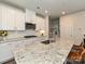 Modern kitchen with granite countertops and stainless steel appliances at 533 Cedar Knoll Cir, Pineville, NC 28134