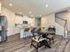 Beautiful kitchen with white cabinets, stainless steel appliances, and hardwood floors at 533 Cedar Knoll Cir, Pineville, NC 28134