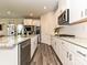 Well-lit kitchen with stainless steel appliances and a spacious island at 533 Cedar Knoll Cir, Pineville, NC 28134