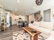Open-concept living room with kitchen, dining area, and hardwood floors at 533 Cedar Knoll Cir, Pineville, NC 28134
