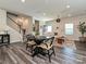 Open living space with kitchen, dining area, and stairs at 533 Cedar Knoll Cir, Pineville, NC 28134