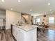 Open living space with kitchen, dining area, and a staircase at 533 Cedar Knoll Cir, Pineville, NC 28134