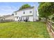 Spacious backyard with a wooden fence, featuring a grill and outdoor seating for relaxation and entertainment at 5549 Lemley Nw Rd, Concord, NC 28027