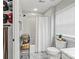 Clean, bright bathroom featuring neutral colors and shower with white curtain at 5549 Lemley Nw Rd, Concord, NC 28027