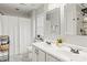 Bright bathroom featuring dual sinks with modern fixtures, shower and large mirror at 5549 Lemley Nw Rd, Concord, NC 28027