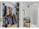 Walk-in closet with ample shelving and a shower stall for convenience at 5549 Lemley Nw Rd, Concord, NC 28027