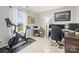 Bright, functional home gym with bike, weights and a view from the window at 5549 Lemley Nw Rd, Concord, NC 28027
