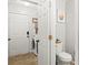 Bright utility area features a laundry pair and an adjacent half bathroom by the back entrance at 5549 Lemley Nw Rd, Concord, NC 28027