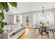 Bright living room featuring hardwood and tile floors, complemented by natural lighting at 5549 Lemley Nw Rd, Concord, NC 28027