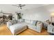 Bright, airy living room with a large sofa, hardwood floors, and open access to kitchen at 5549 Lemley Nw Rd, Concord, NC 28027