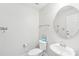 Bright powder room with a stylish round mirror, modern sink and toilet at 6006 Waxhaw Crossing Dr, Waxhaw, NC 28173