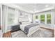 Serene bedroom with tray ceiling, multiple windows, and neutral decor at 6006 Waxhaw Crossing Dr, Waxhaw, NC 28173