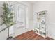 Bright entryway with a decorative tree, a stylish shelving unit and ample natural light at 6006 Waxhaw Crossing Dr, Waxhaw, NC 28173
