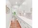 Hallway lined with custom cabinets and counter space, leading to the kitchen at 6006 Waxhaw Crossing Dr, Waxhaw, NC 28173
