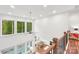 The living room has high ceilings, lots of windows, and a dining area in an open concept design at 6006 Waxhaw Crossing Dr, Waxhaw, NC 28173