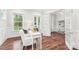 Bright office space with wood flooring, white trim, and multiple windows at 6006 Waxhaw Crossing Dr, Waxhaw, NC 28173
