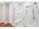New glass-enclosed shower with white subway tile, a shower bench, and brushed nickel fixtures at 6006 Waxhaw Crossing Dr, Waxhaw, NC 28173