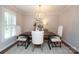 Elegant dining room with a dark wood table, upholstered chairs, and a chandelier at 6036 Sharon Acres Rd, Charlotte, NC 28210