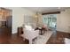 Cozy living room with hardwood floors, a plush sofa, stylish seating, and access to the backyard at 6036 Sharon Acres Rd, Charlotte, NC 28210