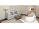 Comfortable living room featuring a soft gray sofa, accent chairs, and stylish decor at 6036 Sharon Acres Rd, Charlotte, NC 28210