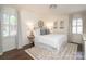 Calm main bedroom with natural light, decor, and a decorative rug at 6036 Sharon Acres Rd, Charlotte, NC 28210