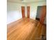 Bedroom with hardwood floors and two closets at 6115 Amberly Ln, Charlotte, NC 28213