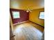 Sunlit bedroom with hardwood floors, and a classic ceiling fan, ready for personal touches at 6115 Amberly Ln, Charlotte, NC 28213