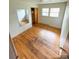 Sunlit bedroom with hardwood floors, closet and a neutral color ready for decor at 6115 Amberly Ln, Charlotte, NC 28213