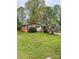 Charming brick home with a lush front lawn and mature trees at 6115 Amberly Ln, Charlotte, NC 28213