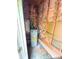 Exposed utility room featuring a hot water heater, and room for storage at 6115 Amberly Ln, Charlotte, NC 28213