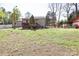 A spacious backyard with a wooden deck and a fence surrounding the property at 6124 Old Plank Rd, Charlotte, NC 28216