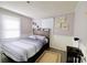 Bedroom featuring natural light, comfortable bed, and wall decor at 6124 Old Plank Rd, Charlotte, NC 28216