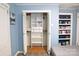 Bedroom with a built-in closet organizer and shelving unit for storage and organization at 6124 Old Plank Rd, Charlotte, NC 28216