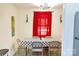 Bright dining room featuring updated light fixture, flooring, and red curtains at 6124 Old Plank Rd, Charlotte, NC 28216