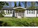 Charming single story home featuring a welcoming front porch, black shutters, and a well-maintained lawn at 6124 Old Plank Rd, Charlotte, NC 28216