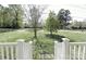 Inviting front yard with a well maintained lawn and view of the neighborhood street and other houses at 6124 Old Plank Rd, Charlotte, NC 28216