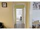 Bright hallway with wood-look floors and views into other rooms, creating an open and connected space at 6124 Old Plank Rd, Charlotte, NC 28216