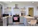 Modern kitchen featuring gray cabinetry, butcher block countertops, and stainless steel appliances at 6124 Old Plank Rd, Charlotte, NC 28216