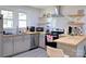 Bright kitchen with stainless steel appliances, butcher block countertops and floating wood shelves at 6124 Old Plank Rd, Charlotte, NC 28216
