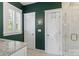 Elegant bathroom features a granite vanity and a glass enclosed shower with white trim at 6165 Caseys Side Way, Fort Mill, SC 29708