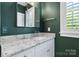 Beautiful bathroom vanity with white cabinets and granite countertops at 6165 Caseys Side Way, Fort Mill, SC 29708
