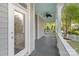 Covered front porch with a ceiling fan offering a relaxing outdoor space at 6165 Caseys Side Way, Fort Mill, SC 29708