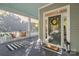 Charming covered front porch with swing, welcome mat, and green entry door at 6165 Caseys Side Way, Fort Mill, SC 29708